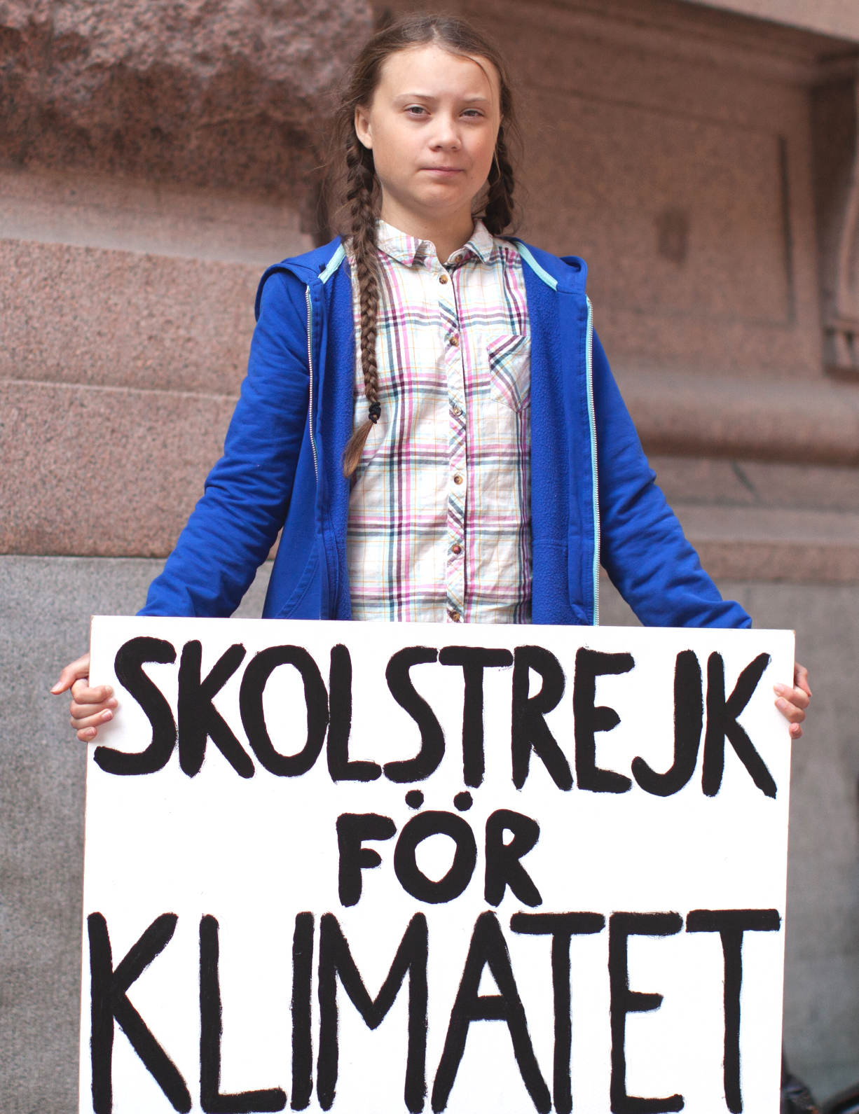 Greta Thunberg with her Skolstrejk For Klimatet sign in Sweden