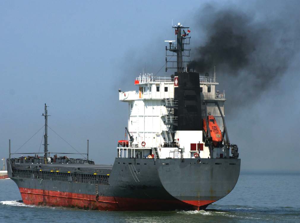 Dirty black smoke bunker fuel exhausts on cargo ships